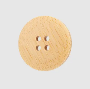 Macro view of a natural bamboo 4-hole button featuring unique wood grain texture