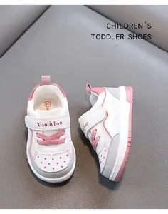 Macro detail of Xiaoliubao pink and white toddler sneakers with breathable soft soles