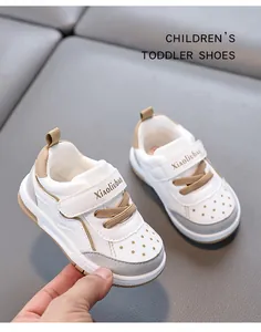 Close-up of toddler walking shoes featuring breathable holes and Velcro straps