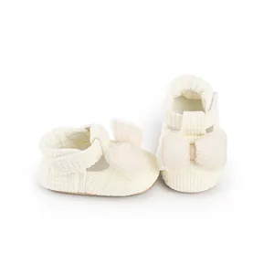 Soft cream baby walking shoes with gauze bow detail and textured fabric for infants