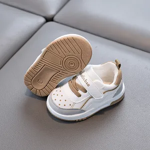 White and tan breathable soft-sole toddler shoes for boys and girls with non-slip bottoms