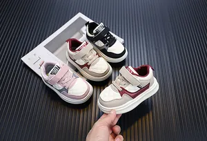Close-up detail of stylish toddler sneakers featuring a quilted pattern and velcro straps