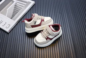 Top view of stylish toddler breathable leisure sneakers in beige and burgundy colors