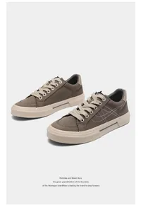 Detailed view of men's casual brown canvas shoes with white stitching and thick soles