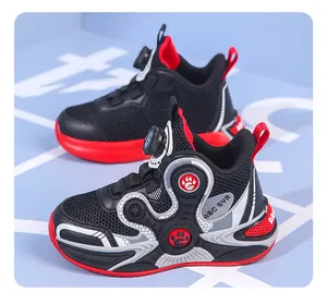Close-up detail of boys' breathable mesh sneakers with a quick rotary dial lacing system.