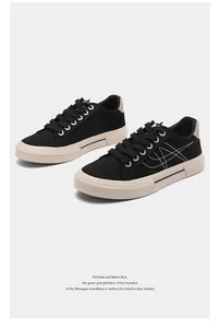 Stylish black low-top men's canvas sneakers with off-white rubber soles for casual wear.