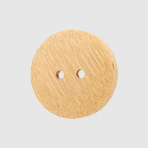 Natural bamboo round button with two holes featuring a clear and elegant wood grain texture