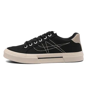 Men's minimalist black canvas low-top casual sneakers with distinctive beige rubber sole