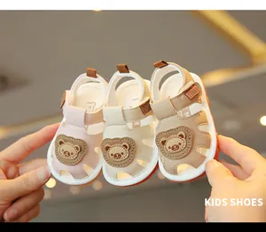 Close-up of toddler cartoon bear sandals in three colors with soft non-slip soles.