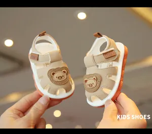 Detailed view of cute cartoon bear baby walking sandals with soft non-slip soles