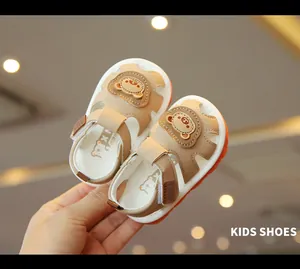 Detailed view of baby cartoon bear sandals with soft soles and adjustable straps