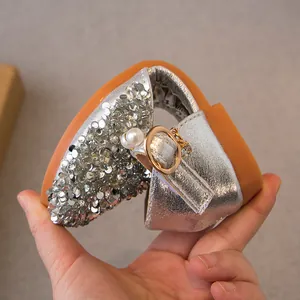 Silver sequined princess sandals for girls featuring a highly flexible sole and pearl buckle
