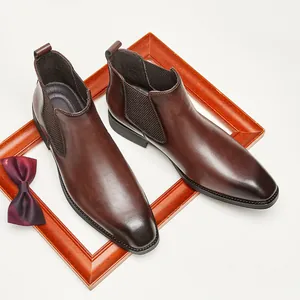 Vintage brown leather Chelsea boots for men with square toe and elastic side panels