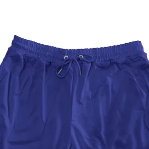 Close-up of elastic waistband and drawstring on blue French terry sweatpants