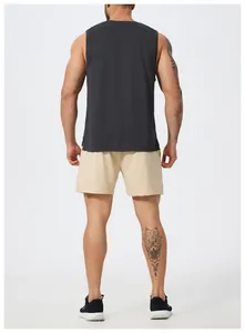 Back view of men's black quick-dry sleeveless sports tank top and beige mesh shorts.