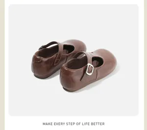 Rear view of brown girls' Mary Jane shoes with silver buckles and soft leather