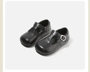 Elegant black T-strap Mary Jane shoes for girls featuring a silver buckle detail