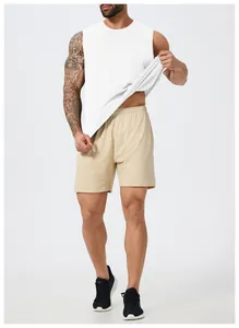 Detail view of a men's white quick-dry sleeveless sports vest paired with mesh shorts.