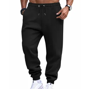 Close-up of men's black athletic sweatpants featuring elastic waistband and drawstring detail.