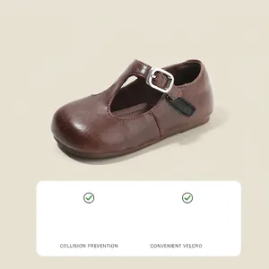 Elegant brown leather Mary Jane shoes for girls featuring a convenient velcro strap design