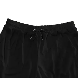 Detailed close-up view of men's black sports joggers waistband with adjustable drawstring