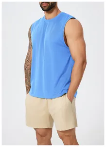 Close-up of blue quick-dry athletic vest showing breathable mesh fabric on male model