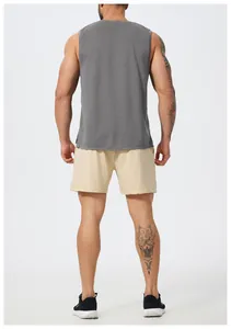 Rear view of a men's grey quick-dry athletic tank top and beige mesh gym shorts.