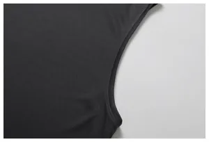 Detail of breathable black mesh fabric and armhole stitching on a men's sports tank top.