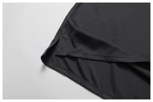Detailed macro view of breathable mesh fabric and side slit hem on men's sports tank top