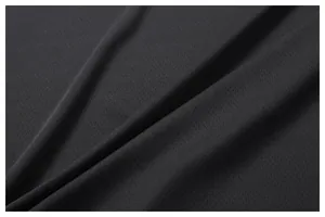 Close-up of black breathable mesh fabric texture for men's quick-dry sports vest