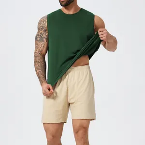 Men's quick-dry sleeveless sports tank top and mesh shorts set in green and beige.