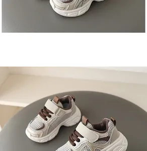 Detailed macro shot of breathable toddler mesh sneakers with soft soles in beige and brown