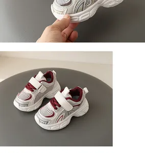 Detailed view of breathable toddler athletic shoes with flexible soft rubber soles