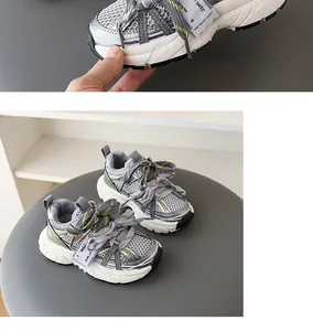 Close-up of breathable mesh and thick sole on kids color-blocked chunky sneakers