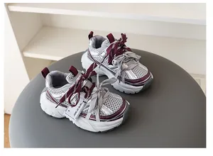 Close-up of children's breathable mesh chunky sneakers with stylish color block design