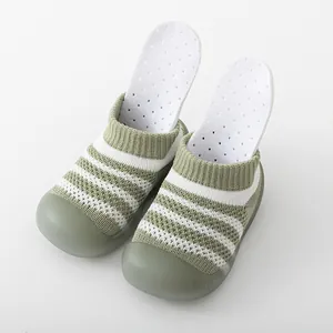 Breathable knitted baby walking shoes with soft non-slip rubber soles in green and white