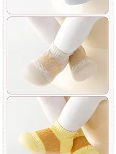Close-up of breathable mesh baby walker shoes with soft non-slip soles.