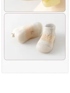 Close-up of breathable mesh baby walking shoes with soft non-slip rubber soles.