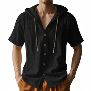 Close-up detail of black linen hooded shirt for men featuring wood buttons and drawstring