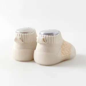 Breathable mesh baby walker shoes featuring anti-slip soft rubber sole in cream color