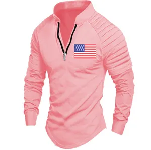 Detail view of pink men's polo with pleated sleeves and American flag chest logo.