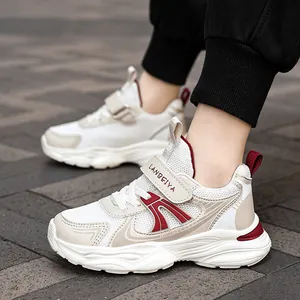 Breathable mesh kids sports sneakers with non-slip sole and red accents for boys
