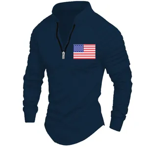 Detail of navy blue men's quarter-zip polo shirt with pleated sleeves and USA flag