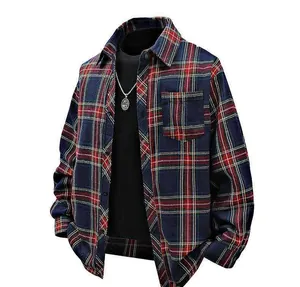 Front detail view of a navy and red plaid flannel shirt layered with a black T-shirt