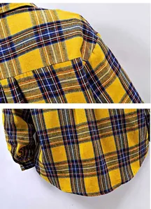 Detailed view of yellow and blue checkered plaid shirt fabric texture
