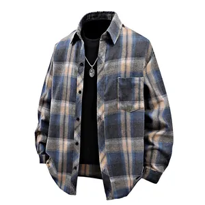 Detail of blue and brown plaid long-sleeve shirt with vintage flannel texture