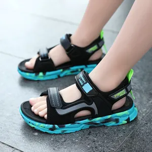 Boys athletic open-toe sandals featuring soft camouflage soles and adjustable velcro straps.