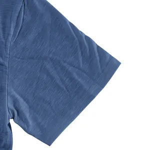 Macro view of short sleeve stitching and blue slub cotton fabric texture for men's T-shirt