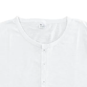 Close-up view of a white men's Henley T-shirt collar showing slub cotton texture.