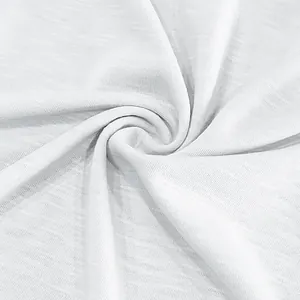 Close-up of white slub cotton fabric showing breathable texture and soft quality drape